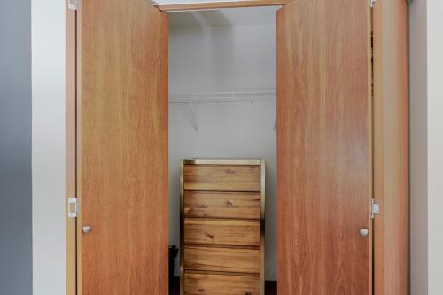 a room with two doors and a small cabinet at Blueground Brighton balcony nr Seward Park SEA-874 in Seattle