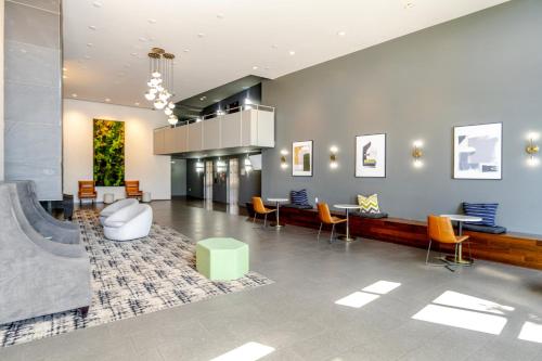 a lobby with chairs and tables and a ramp at Blueground Brighton balcony nr Seward Park SEA-874 in Seattle