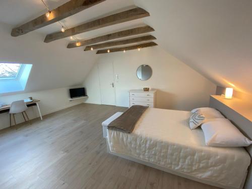 Ένα ή περισσότερα κρεβάτια σε δωμάτιο στο Oh COEUR DU BOUYSSOU