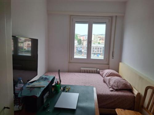 Кровать или кровати в номере Appartement équipé à louer à Ecublens