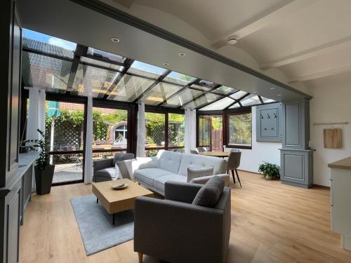 a living room with a couch and a table at Spreewaldapartments-Kossatz in Lübben