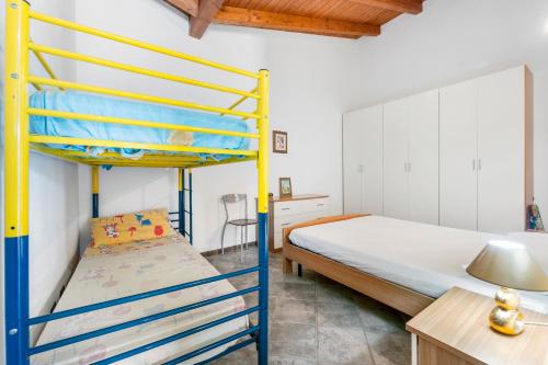 Postel nebo postele na pokoji v ubytování Residence Sulcis 2