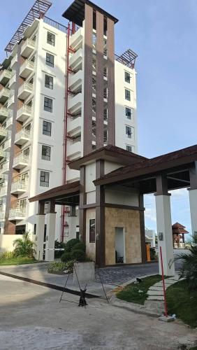 a large apartment building with a star in front of it at Royal Oceancrest Panglao Seaview in Dauis