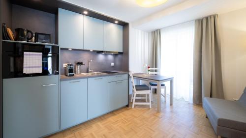 Kuchyň nebo kuchyňský kout v ubytování Aparthotel Klopeinersee
