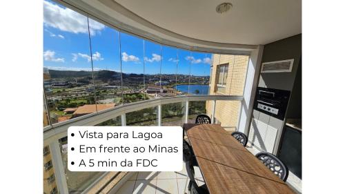 a balcony with a view of a city at Lindo AP com vista para a Lagoa dos Ingleses in Nova Lima