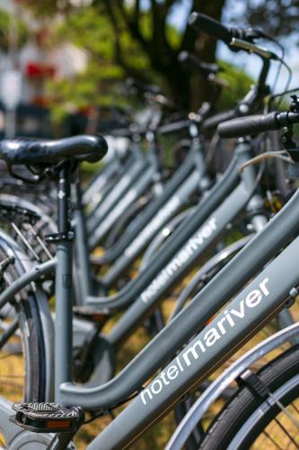 a row of bikes parked next to each other at Hotel Mariver in Lido di Jesolo