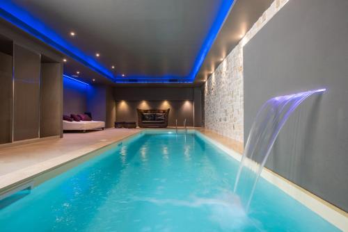 a swimming pool with a water feature in a house at Fortyfive Squared Hotel in Rome
