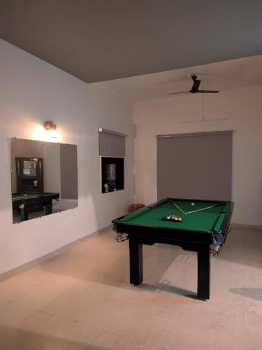 a living room with a pool table in it at Sanctuary by Nagarik Commune in Pune