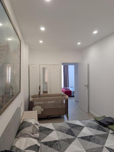a bedroom with a bed and a large mirror at Ca l'Emília, hasta 6 pers, Monistrol de Montserrat in Monistrol