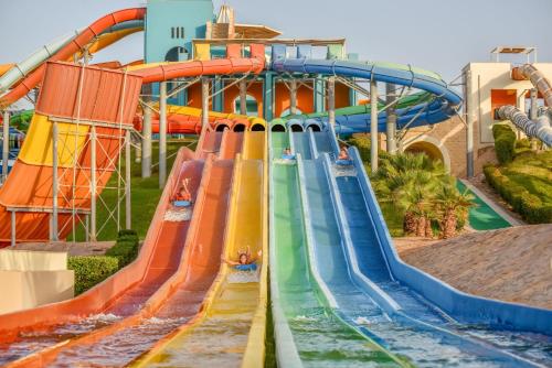 a water slide at a water park with people on it at JAZ Makadi Saraya Resort in Hurghada