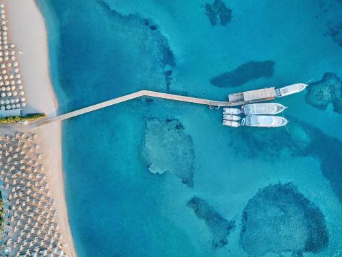 an aerial view of a boat in the ocean at JAZ Makadi Saraya Resort in Hurghada