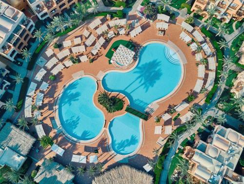 an overhead view of a pool at a resort at JAZ Makadi Saraya Resort in Hurghada