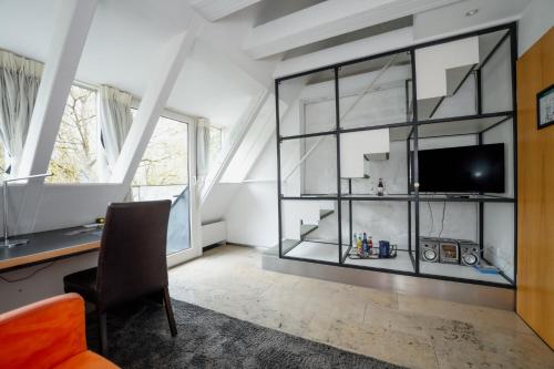 a living room with a large glass wall at Mühle am Schlossberg in Wartenberg-Rohrbach