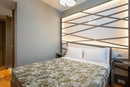 a bedroom with a bed in a room at Fortyfive Squared Hotel in Rome