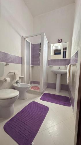 a bathroom with a sink and a toilet and a sink at Beb al porto da joseph in Trapani