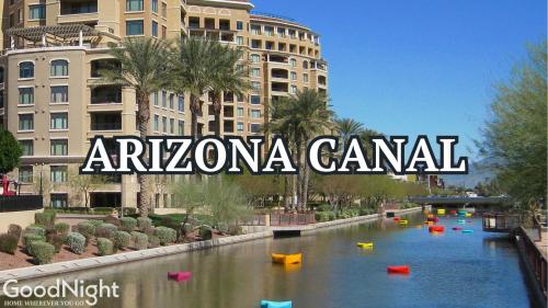 a river in a city with buildings in the background at LUXE - Nouveau - Sparkling Pool - Walk to Old Town in Scottsdale