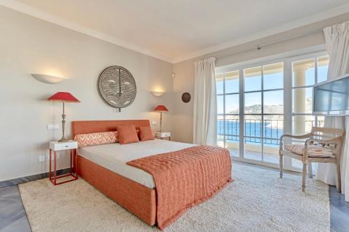 a bedroom with a bed and a large window at Modern Andratx Villa Ocean Views, 1031 in Andratx