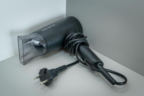 a black flashlight sitting on a table at Daria Boutique Hotel in Eforie Sud