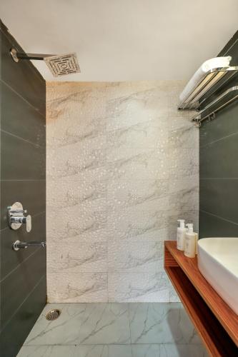 a bathroom with a sink and a shower at SaffronStays Aquadome Celeste -River Access Stay in Bhikia Sain