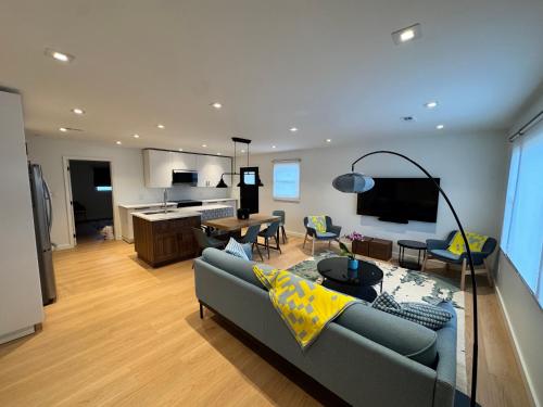 a living room with a couch and a table at Newly Renovated house in the Best location of TriCities in Johnson City