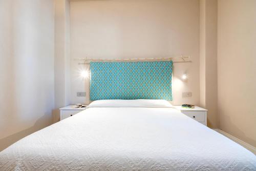 Ένα ή περισσότερα κρεβάτια σε δωμάτιο στο Dimora Sella Rooms
