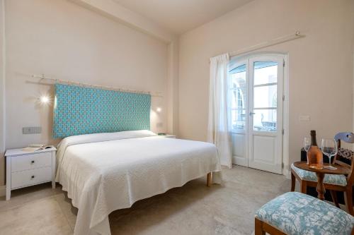 Ένα ή περισσότερα κρεβάτια σε δωμάτιο στο Dimora Sella Rooms