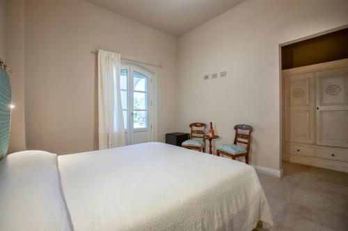 Ένα ή περισσότερα κρεβάτια σε δωμάτιο στο Dimora Sella Rooms