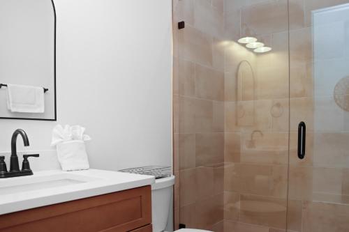 a bathroom with a shower and a sink at Highball Heaven by Pristine Properties Vacation Rentals in Port Saint Joe