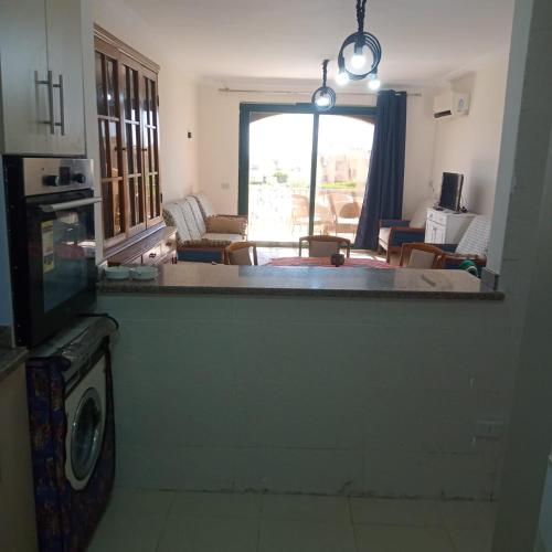 a kitchen and living room with a view of a living room at See your sea in Ras Sedr