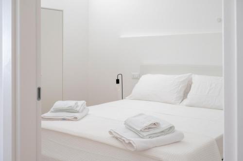 Katil atau katil-katil dalam bilik di Ingrosso Suites in Salento