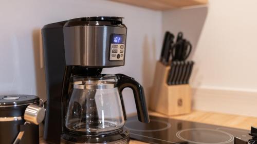 a coffee maker sitting on top of a counter at High Creek Lodge and Cabins in Pagosa Springs