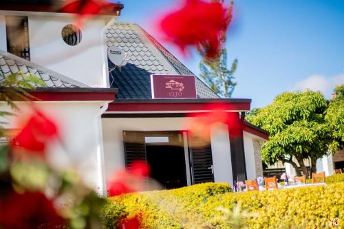 a building with a sign on the front of it at Cléo Hôtel-Restaurant in Fianarantsoa