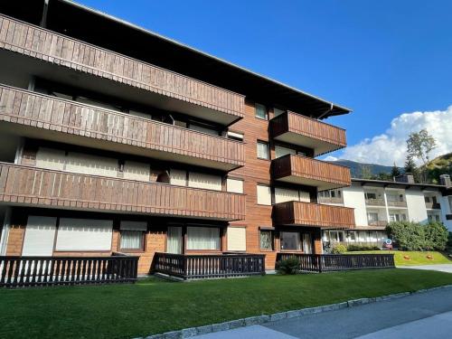 a building with balconies on the side of it at Haus Thalgau E14 in Saalbach Hinterglemm