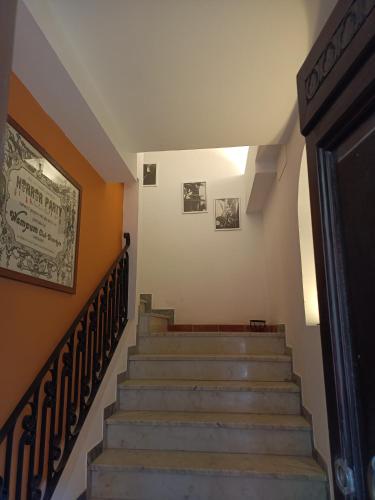 a staircase in a building with a picture on the wall at Dimora FinAmore 29 - Casa Vacanze in Lanciano
