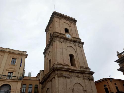 a tall tower with a clock on top of it at Dimora FinAmore 29 - Casa Vacanze in Lanciano