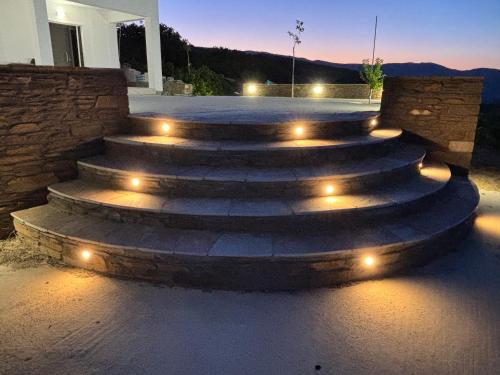 a set of concrete steps with lights on them at Cavo Levante in Andros