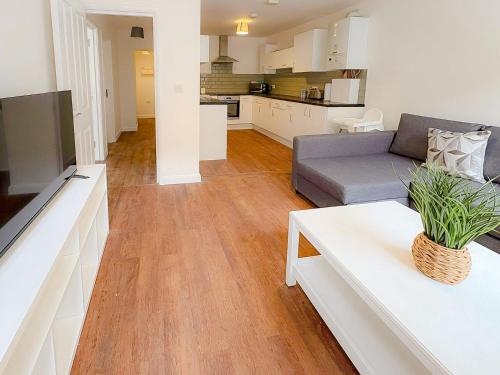 a living room with a couch and a table at 58d Thorpe road in Norwich