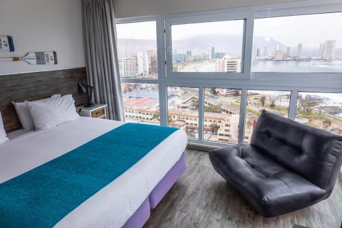 Gran Cavancha Hotel & Apartmentにあるベッド