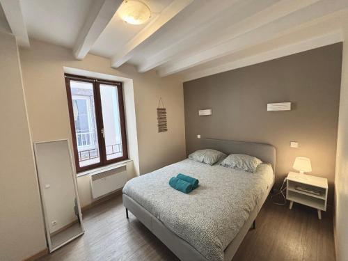 Ένα ή περισσότερα κρεβάτια σε δωμάτιο στο Charmant T2 au cœur de la ville