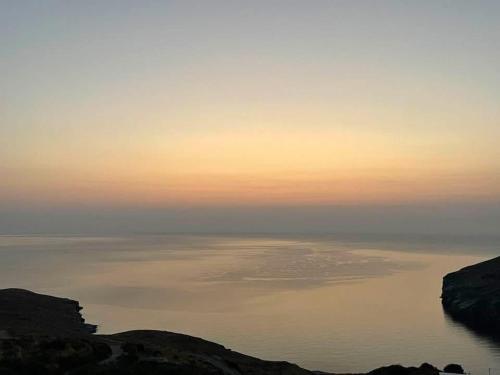 a view of the ocean at sunset at Cavo Levante in Andros