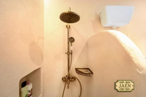 a bathroom with a shower in the corner of a room at Mi Andalusia Hotel Experience in Málaga