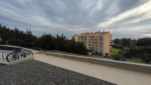 a balcony with a view of a building at Oceana Suites Santo Domingo in Santo Domingo