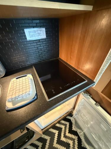 a desk with a keyboard on a counter top at Bagshaw Lodge in Bakewell