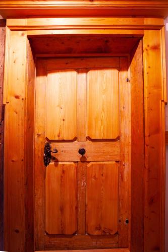 a wooden door in a room with at Living History (adults only) in Hallstatt