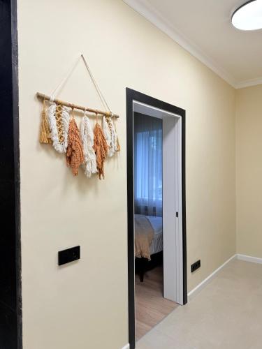 a room with a door leading to a bedroom at DendroBak GuestHouse in Stepʼanavan