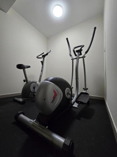a gym with three exercise bikes in a room at Willa pod Smrekiem in Białka Tatrzanska
