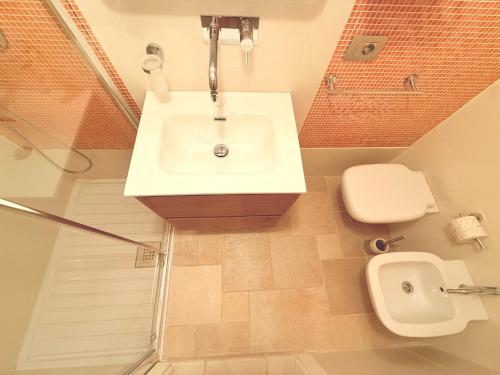 a bathroom with a sink and a toilet at Suite Salgemma in Polignano a Mare