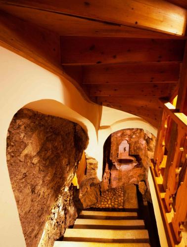 a view of a staircase in a building with a stone wall at Living History (adults only) in Hallstatt