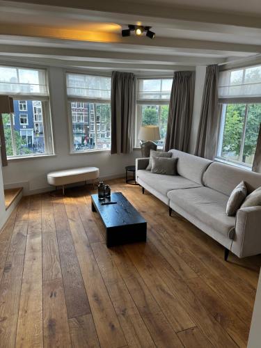a living room with a couch and a coffee table at Boutique LaBeau in Amsterdam