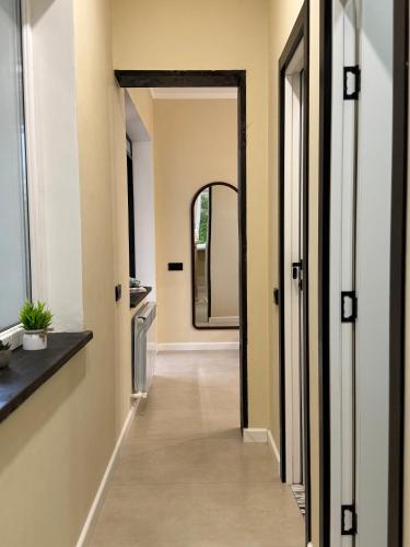 a hallway of a house with a mirror in it at DendroBak GuestHouse in Stepʼanavan